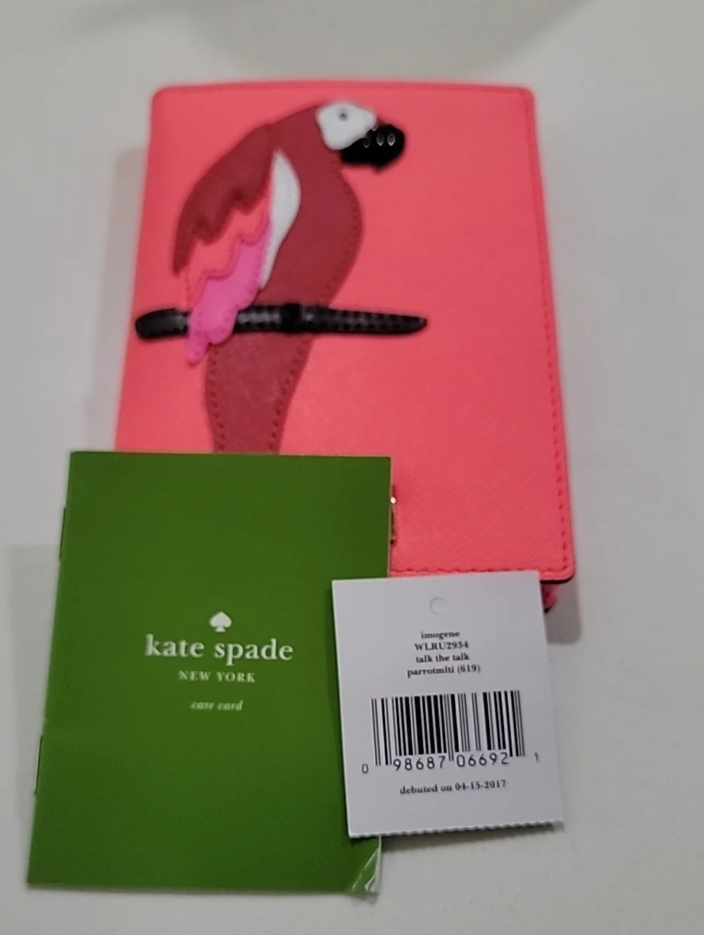 kate spade coral Talk The Talk Imogene Passport Holder Featuring Parrot